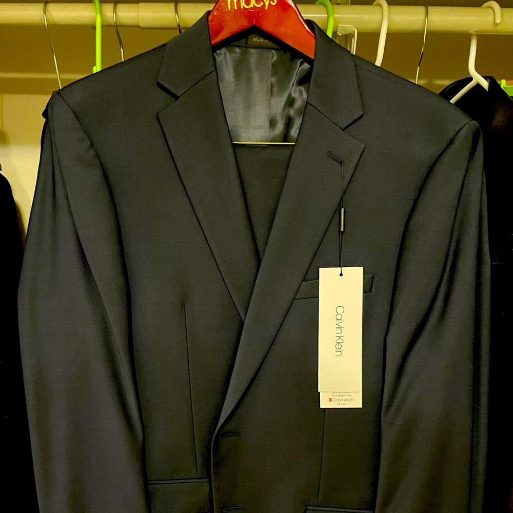 Brand new midnight blue Calvin Klein suit in 42Reg and trousers in 38W x 32L